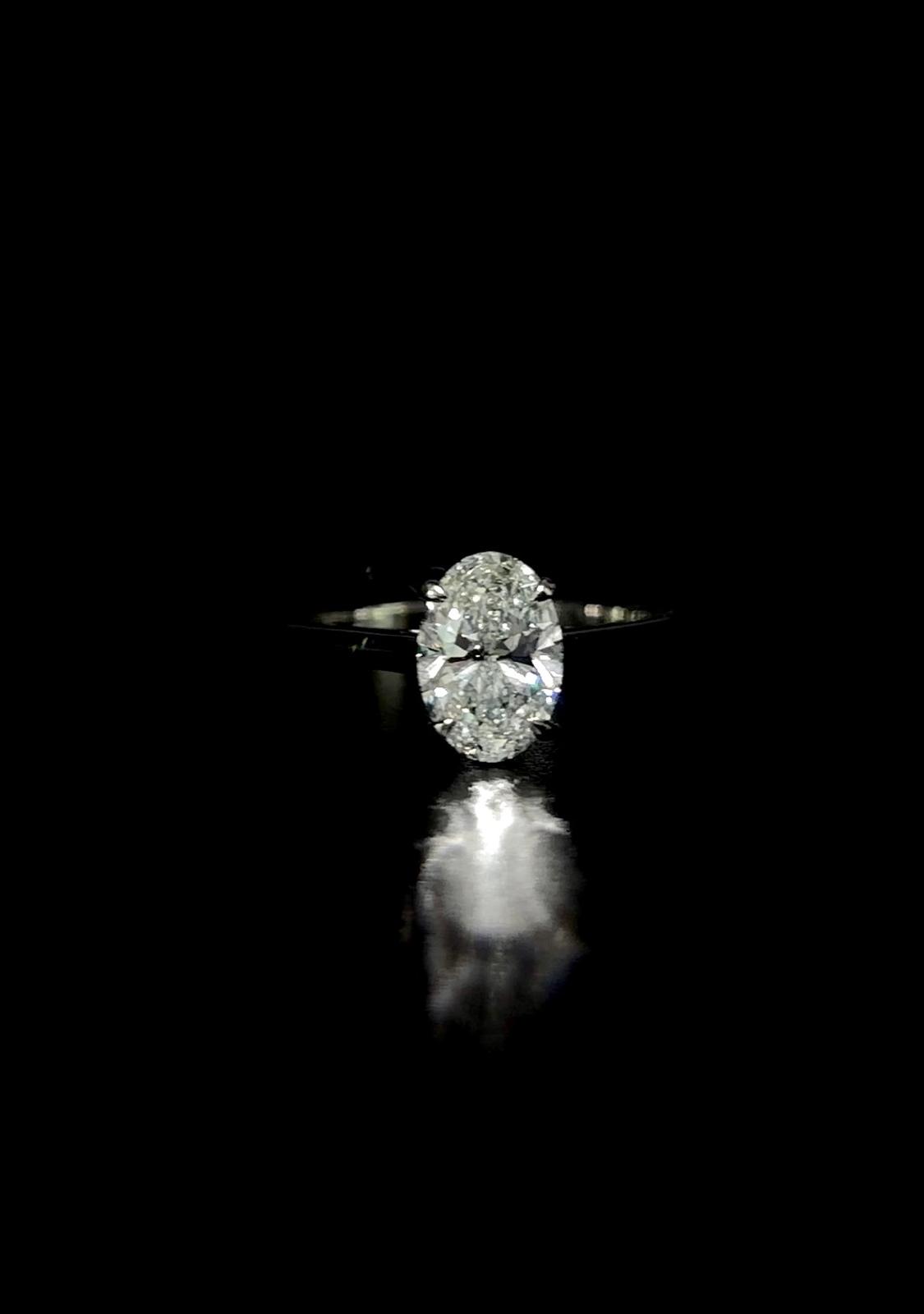 A statement oval centre stone on a slender platinum band.